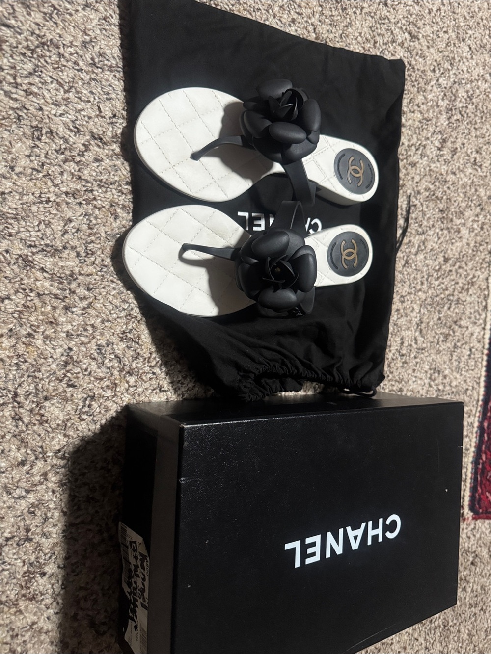 CHANEL Black Camellia Quilted-White Leather Flip Flops